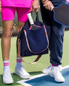 Pink pickleball socks styled with saltie rose pickleball tote