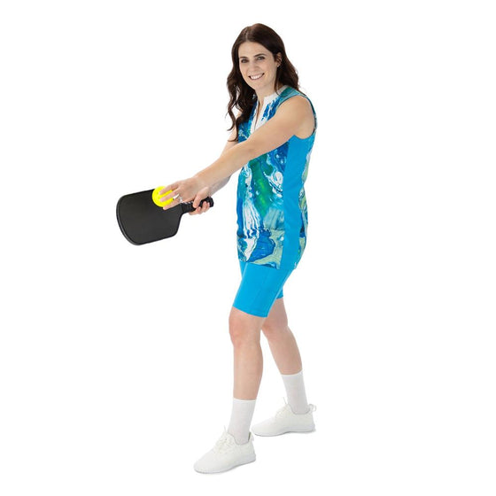 Aqua marbled v-neck tunic, with aqua blue side panels, aqua pickleball shorts with nine inch inseam