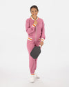 Saltie Rose Pink Bomber with orange and white stripe at waist, collar, and wrists, paired with Pink joggers with orange and white stripe band at ankles.