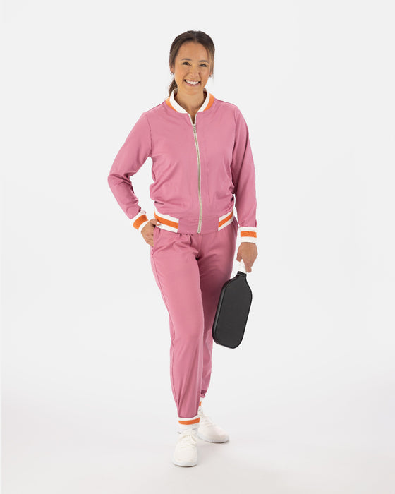 Saltie Rose Pink Bomber with orange and white stripe at waist, collar, and wrists, paired with Pink joggers with orange and white stripe band at ankles.