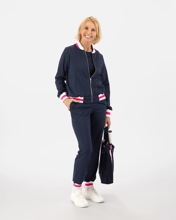 Saltie Rose Navy Bomber with pink and white stripe at waist, collar, and wrists, paired with Navy joggers with pink and white stripe band at ankles.