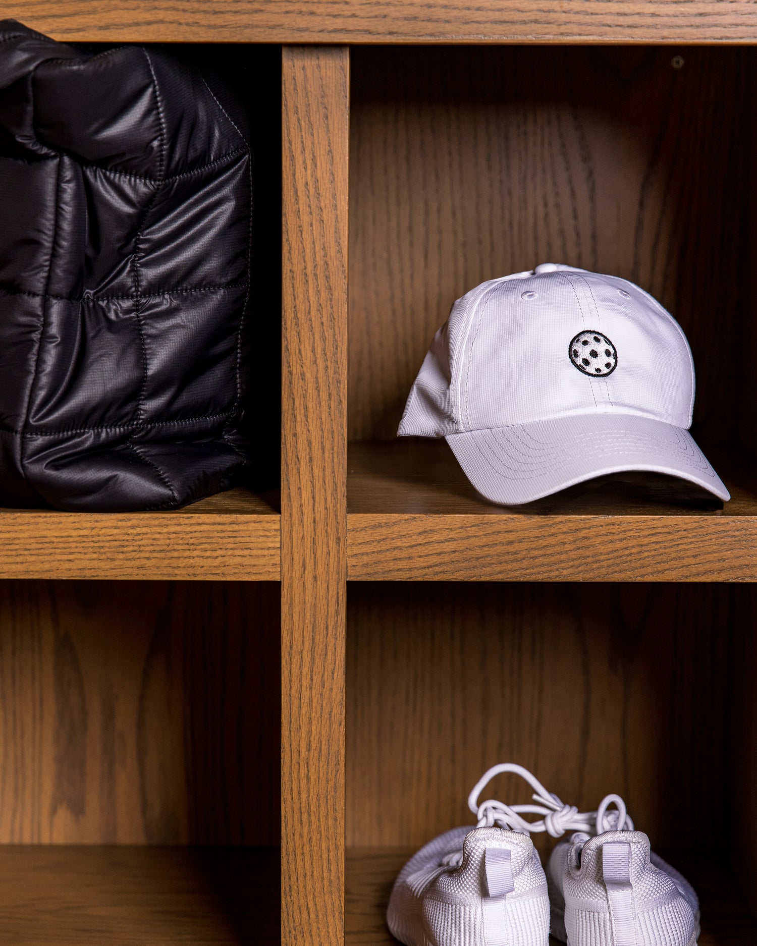 Saltie Rose Pickleball hat on a shelf