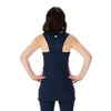 Midnight blue racerback tunic with pink and white striped side panels, blue pickleball shorts with nine inch inseam