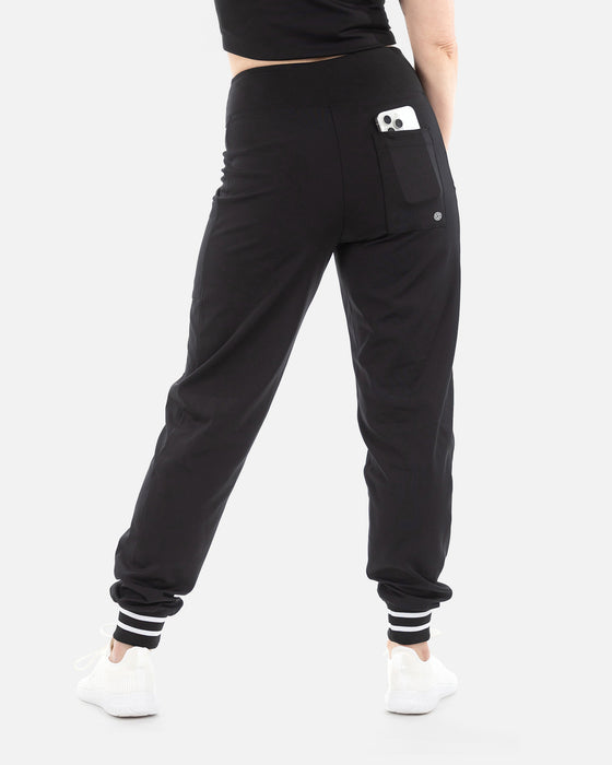 Saltie Rose Pickleball Joggers  in black with black and white striped cuff, rear view with pocket and pickleball logo