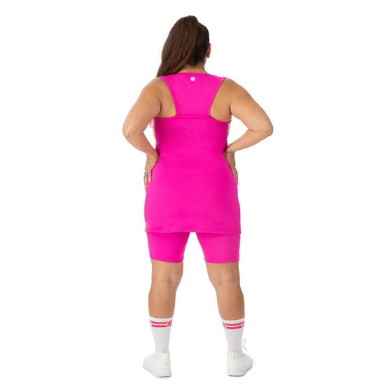 Pink racerback tunic with warm toned marble side panels and nine inch inseam pickleball shorts