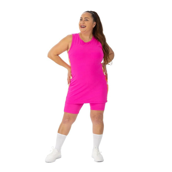 Pink racerback tunic with warm toned marble side panels and nine inch inseam pickleball shorts