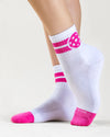 white pickleball crew socks with pink stripes and pickleballs on ankle and pink toe accent. 